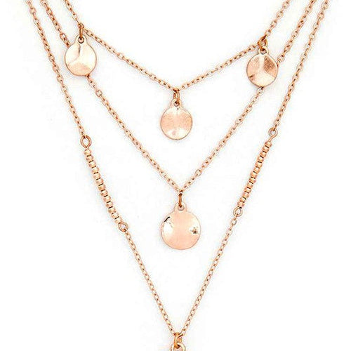 Rose gold layered necklace with a cross pendant on a white background