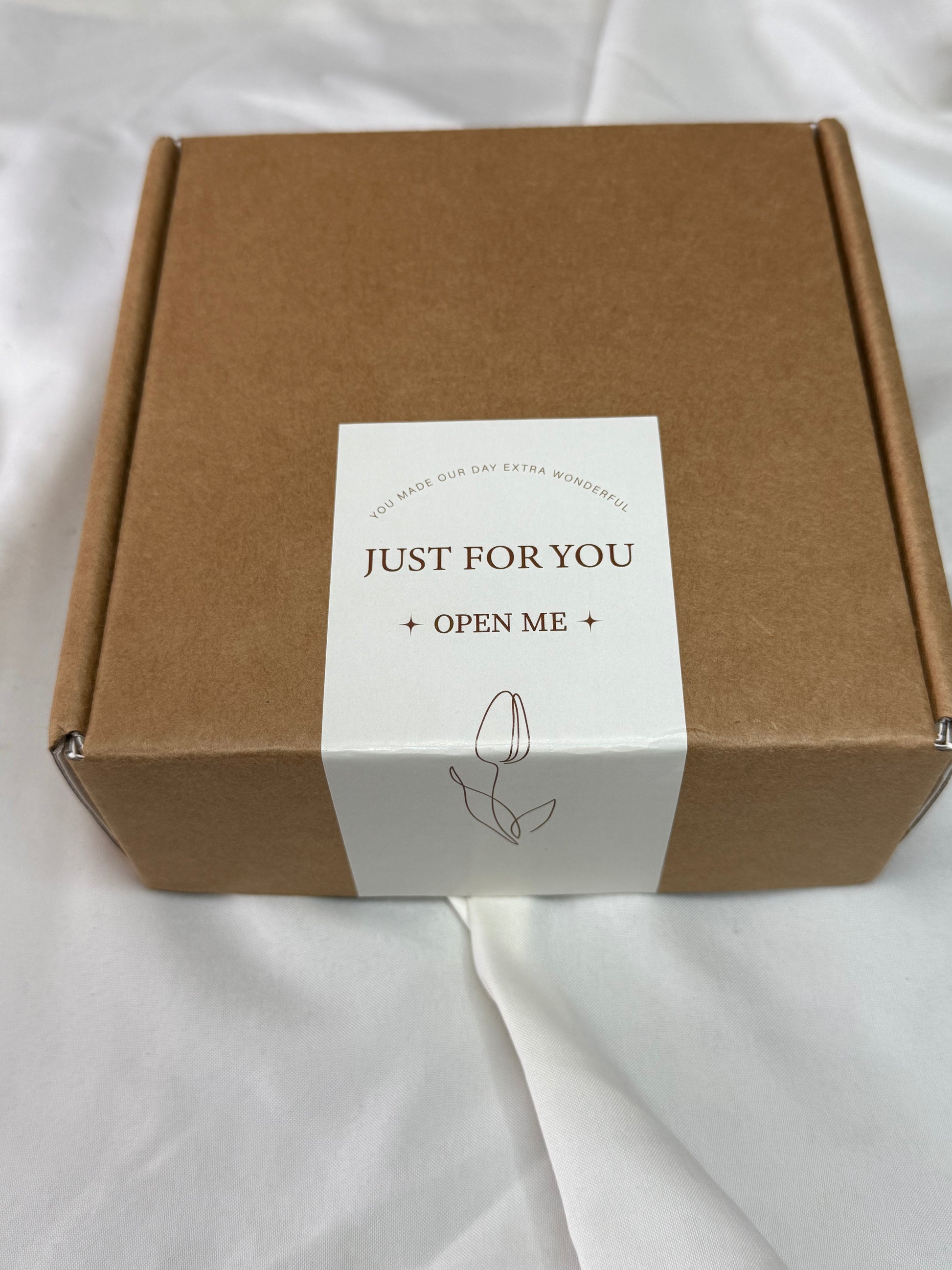 Brown box with a white label on a white background