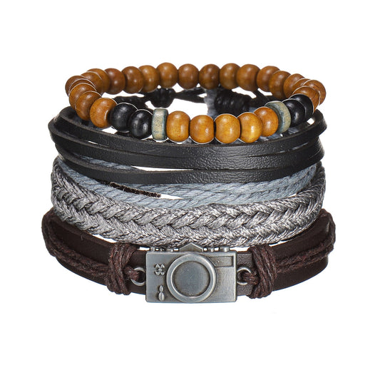 Stack of multi-layered bracelets with beads and leather straps on a white background