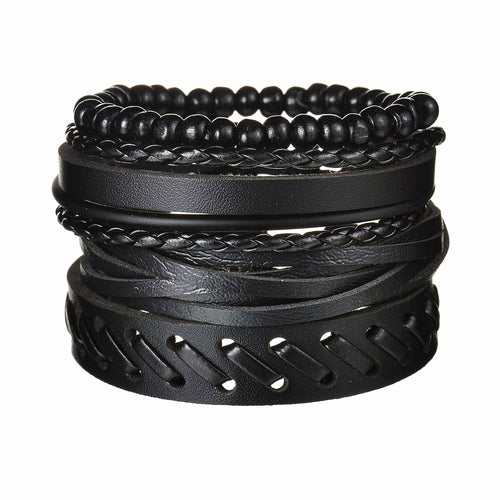 Stack of black leather bracelets on a white background