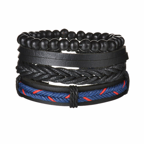 Stack of black beaded, braided, and rope bracelets on a white background