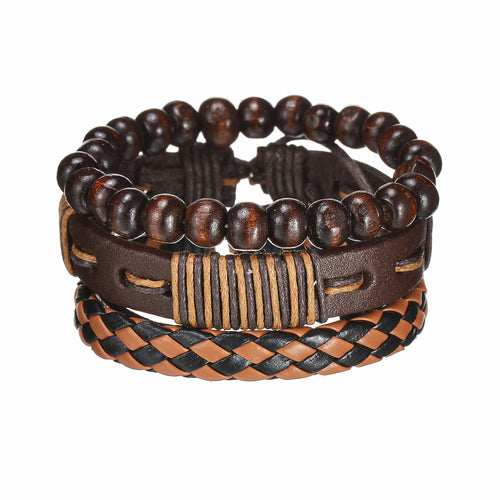 Stack of brown leather and wooden bead bracelets on a white background