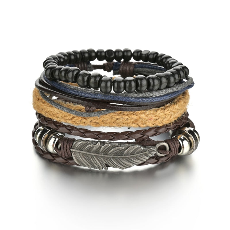Stack of multi-layered bracelets with leather, beads, and metal accents on a white background