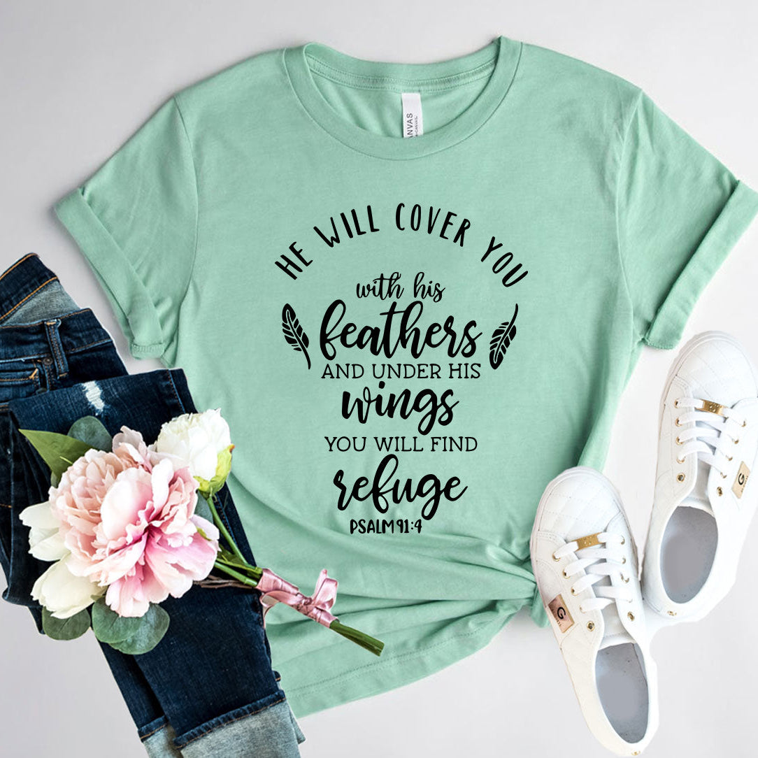 Mint green t-shirt with motivational quote, jeans, flowers, and sneakers on a light gray background