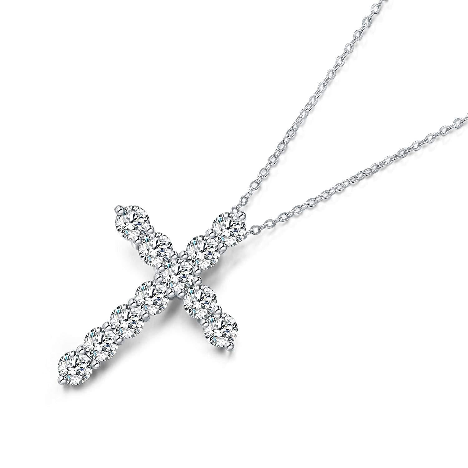 Silver cross-shaped pendant necklace on a white background